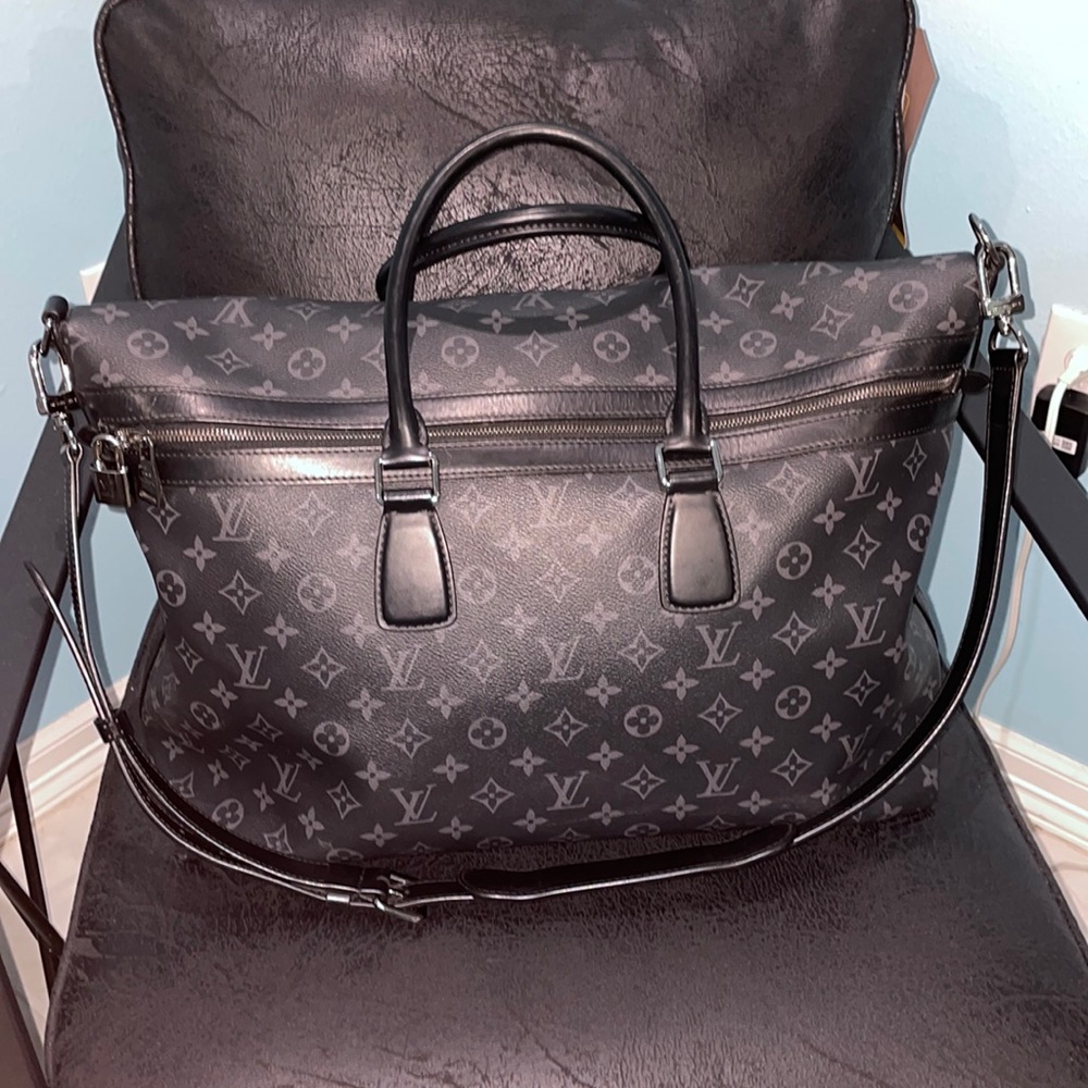 Black Louis Vuitton weekender bag